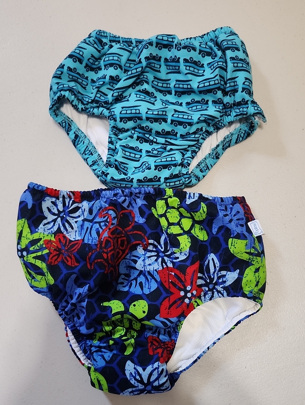EUC 2 Pairs SzXL&3T Toddler Swim Diapers in Aqua, Navy & Bright Accent Prints.